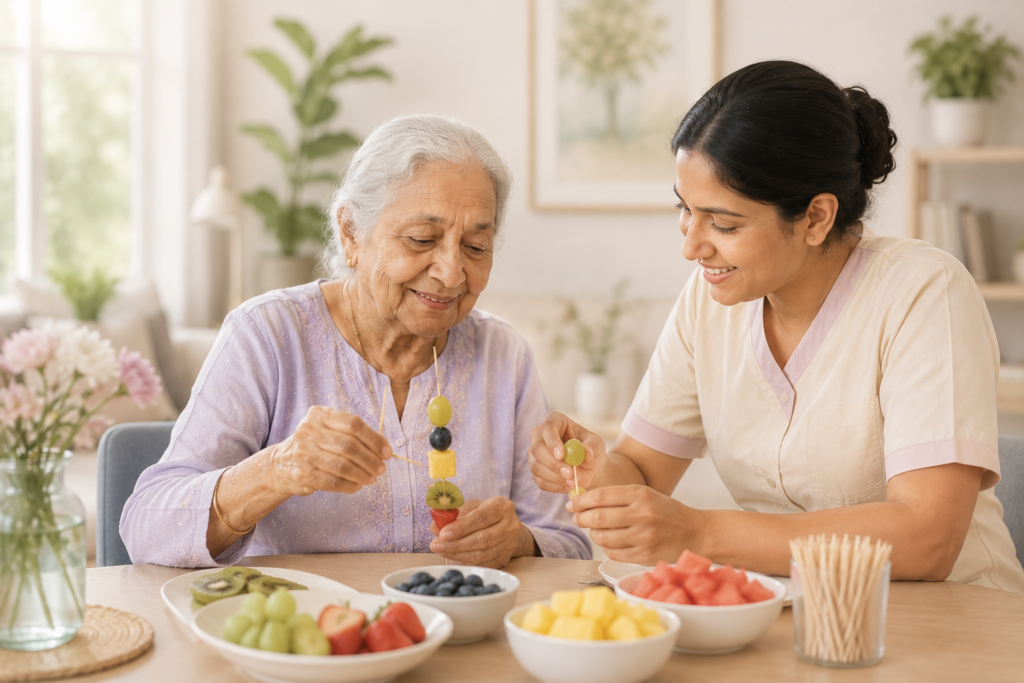 Elderly woman and caregiver preparing fruit skewers together during a cognitive stimulation activity in a dementia care facility in Kochi, promoting memory, coordination, and social engagement.
