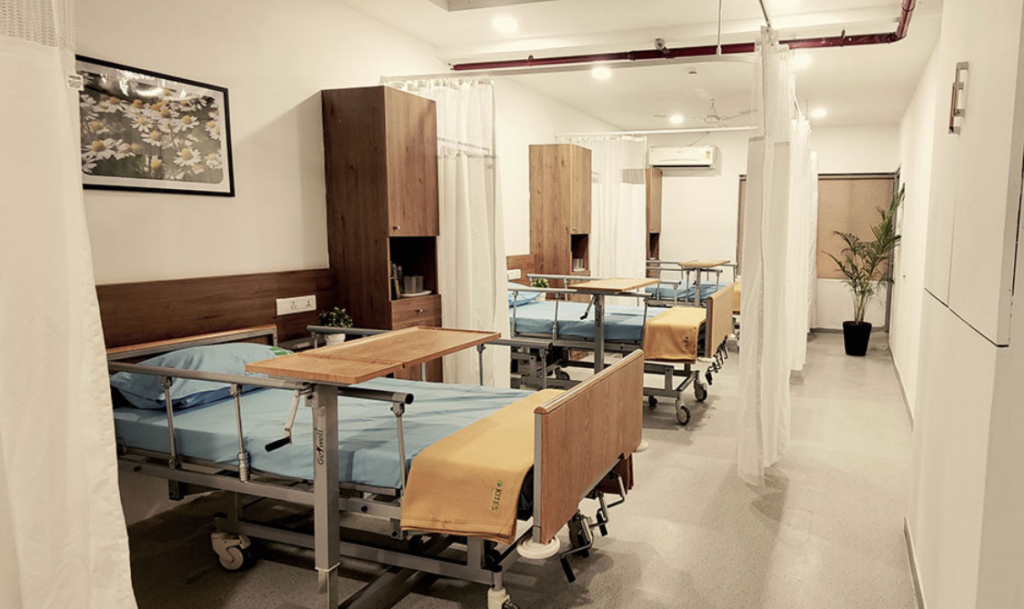 Modern and brightly lit interior corridor of KITES Premium Senior Care Centre designed for elderly safety.
